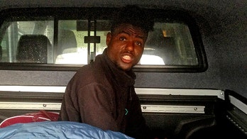 Refugee hitches ride in trunk of UK couple's car  on return trip from vacation