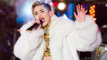 Miley Cyrus spotted making out with Paris Hilton at Miami club, source says