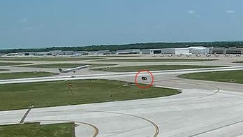 Airplane narrowly avoids hitting van crossing runway in Missouri airport