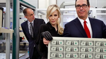 Treasury boss Mnuchin, wife raise eyebrows with big money photo op