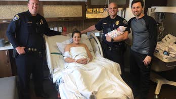 Police officers help mom deliver baby in post office parking lot