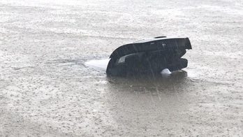 Tropical Storm Cindy: Video captures rescue of woman in submerged car