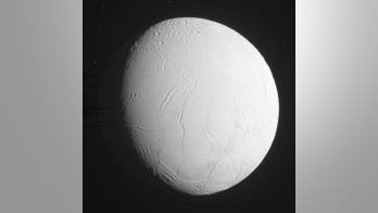 The icy world of Saturn's moon Enceladus comes into view