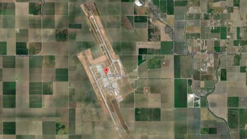 SUV fleeing police crashes into jet at California naval base