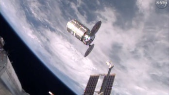 Space station astronauts give huge trash can the boot
