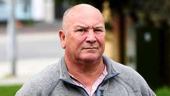 Millionaire taunts lesbians by blasting songs about men in feud over rooster