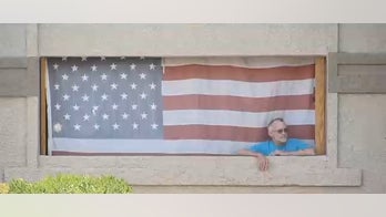 Veteran fights apartment complex over his American flag display