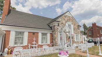 Statue-filled 'once in a lifetime' house comes with vintage cars, custom features