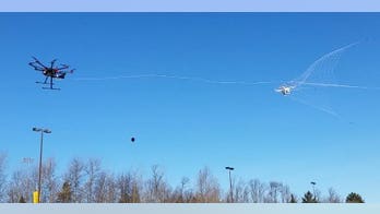 This anti-UAV octocopter uses a ballistic net cannon to disable smaller drones
