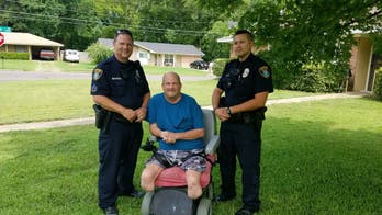 Police officers mow lawn of disabled veteran