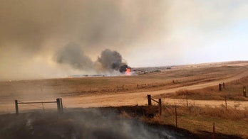 Wildfire spares Oklahoma town, plant but still not contained