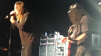 Ozzy Osbourne gets sobriety award, rewards crowd with bucket of water