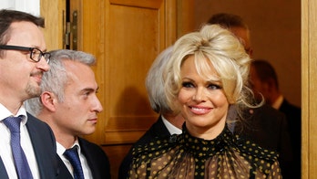 Pam Anderson auctions off selfies at charity gala