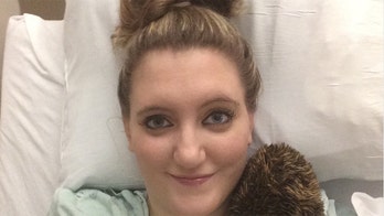 Family raising funds for former Marine's pregnant wife paralyzed in alleged armed robbery