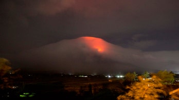 Thousands displaced as Philippine volcano erupts and lava flows