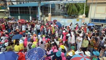 Cambodia PM says garment firms may quit over wage rows