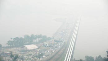 Indonesia deploys aircraft as Singapore haze hits record