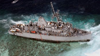 US blames captain for ship loss on Philippine reef