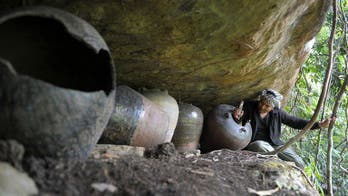 Cambodian jungle graveyard mystifies experts