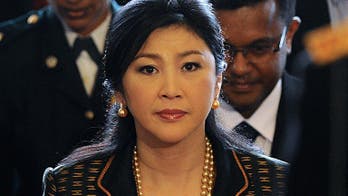 Thai PM shuffles pack and takes key defence post