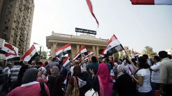 Morsi camp slams 'coup' as Egypt leader hit with travel ban