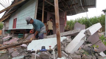 Aid reaches Indonesia villages after deadly quake