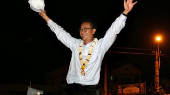 Cambodian self-exiled opposition head vows poll return