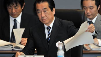Japan's former premier sues PM Abe