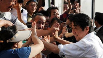 PM Abe bids for stronger hand as Japan votes