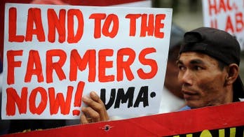 Philippine leader says to start dividing family farm