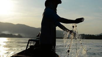 As dams loom, Mekong fishermen fear for their future