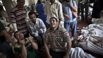 Morsi loyalists mourn their dead, as clean-up underway in protest camp