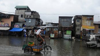 Flooded Philippine capital shuts down