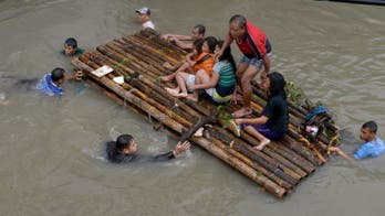 Heavy rain pummels flooded Philippines