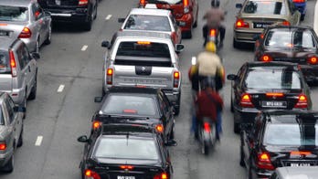 Coach tumbles into Malaysian ravine