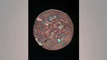 Puzzle over African coins reveals Aboriginal rock art