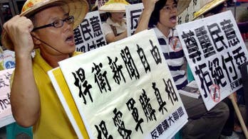 Taiwan 'to go on buying arms from US'