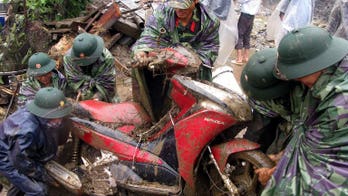 Vietnam flood toll hits 21