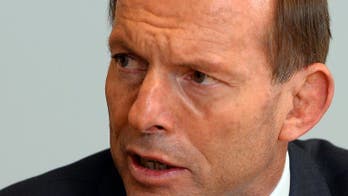 Australia's Abbott begins transition but faces hurdles