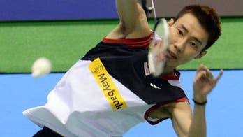 Lee wins Japan Open despite coach trouble