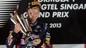 Singapore sting as booed Vettel wins again