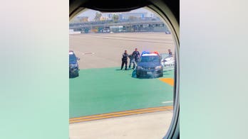 Man jumps fence at LAX, does pushups on runway, police say