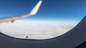 Why do airplane windows have tiny holes?