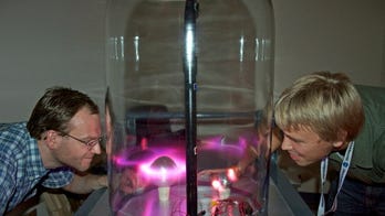 Scientists spark auroras in a bottle for traveling Northern Lights show