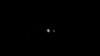 NASA probe sees Pluto and its moon Charon like never before