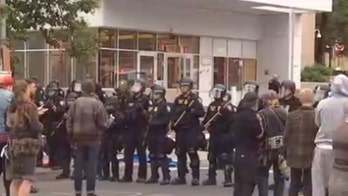 Portland ICE facility protest camp broken up by feds as crowds shout 'no racist police!'