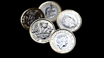 UK battles counterfeiters, launches ‘most secure coin in the world’