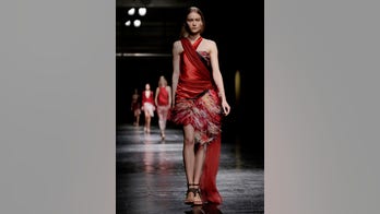 Streaker clad in animal-print G-string interupts fashion show