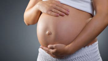 Surrogate defies birth parents' abortion demand