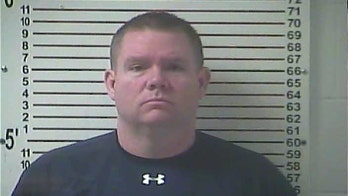 Police: Principal admits stealing nude images from students